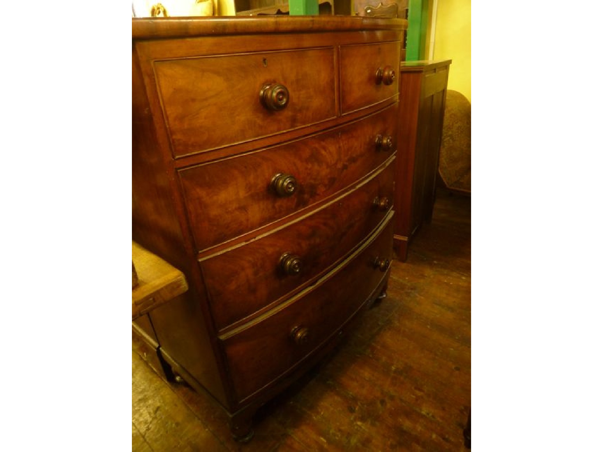 Appraisal: A Victorian mahogany bow fronted bedroom chest of three long