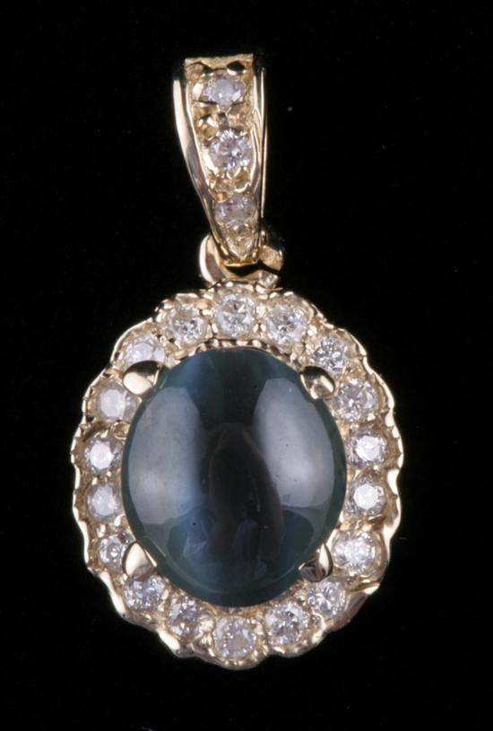 Appraisal: K YELLOW GOLD CAT'S EYE ALEXANDRITE AND DIAMOND PENDANT Oval