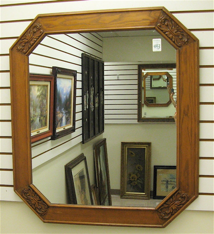 Appraisal: AN OAK FRAMED WALL MIRROR of rectangular form with carved