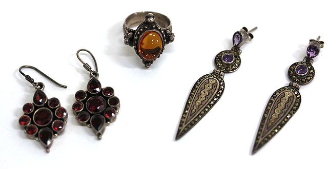 Appraisal: A PAIR OF GARNET SET SILVER DROP EARRINGS together with