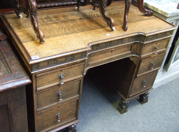 Appraisal: A th century oak kneehole desk the breakfront top with