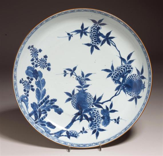 Appraisal: A PAIR OF BLUE-AND-WHITE CHARGERS WITH POMEGRANATE DESIGN China th