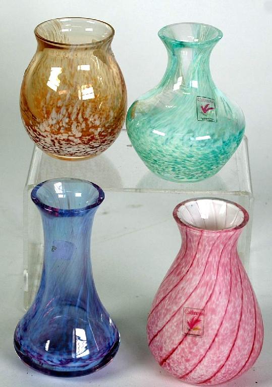 Appraisal: CAITHNESS STUDIO GLASS SMALL VASES in green blue and amber