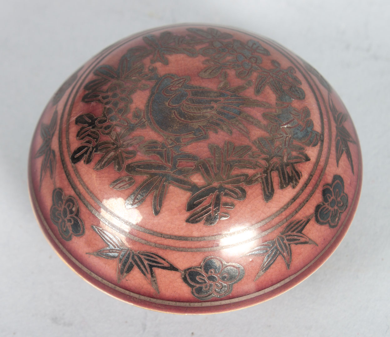 Appraisal: Japanese silver overlaid earthenware rouge pot lid with silver overlay