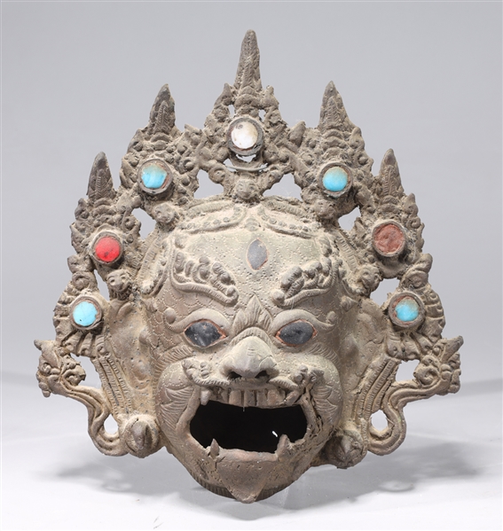 Appraisal: Antique Indonesian metal mask with inlayed eyes and glass jewels