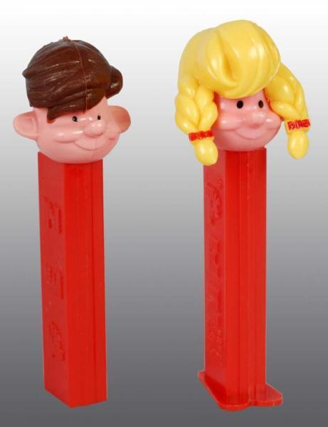 Appraisal: Boy and Girl Pez Dispensers Description Boy does not have