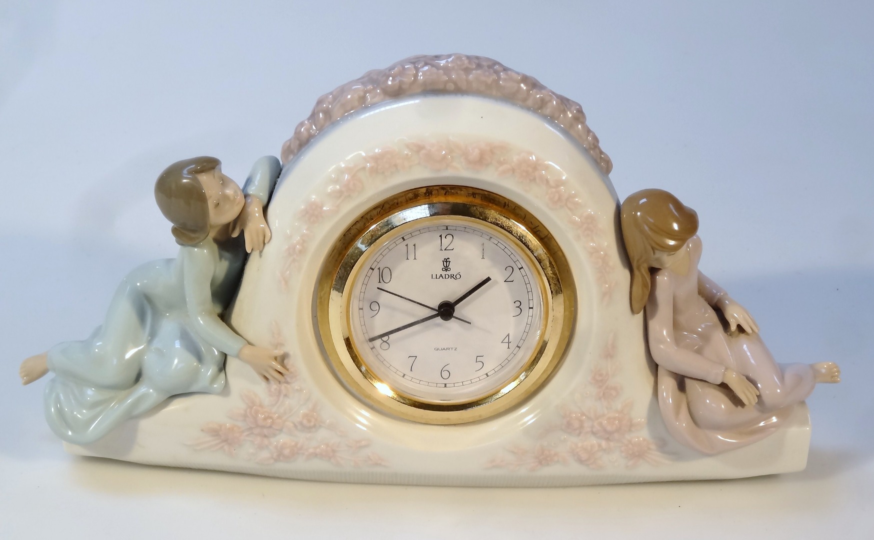 Appraisal: A Lladro clock group Napoleon hat shaped flanked by two