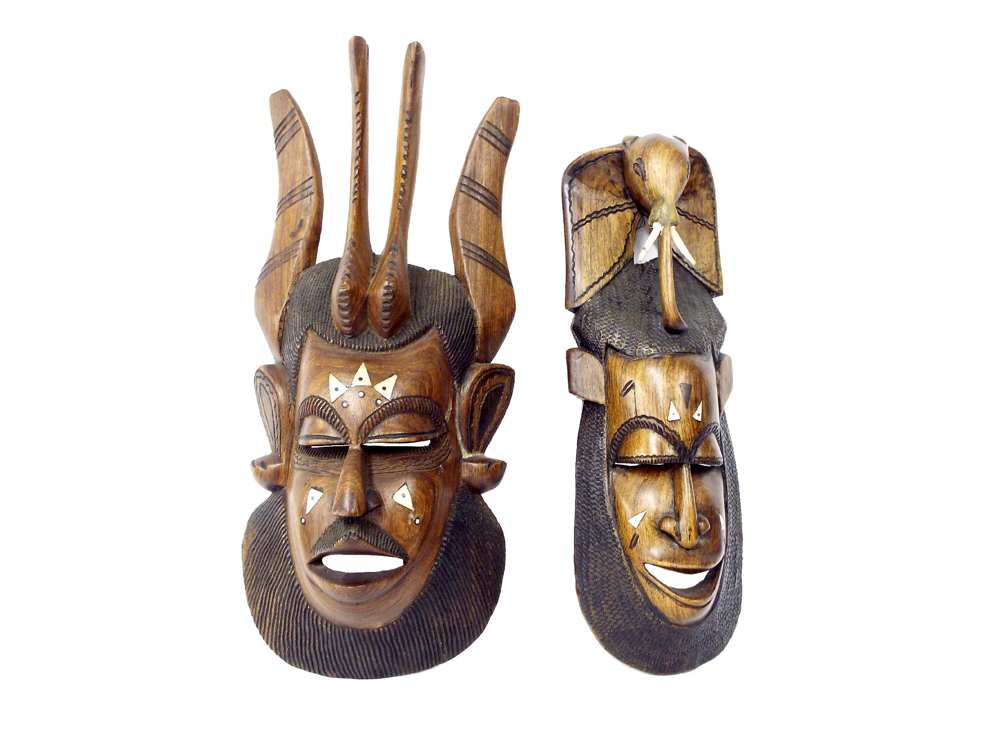 Appraisal: Pair of carved tribal masks one with elephant head mount