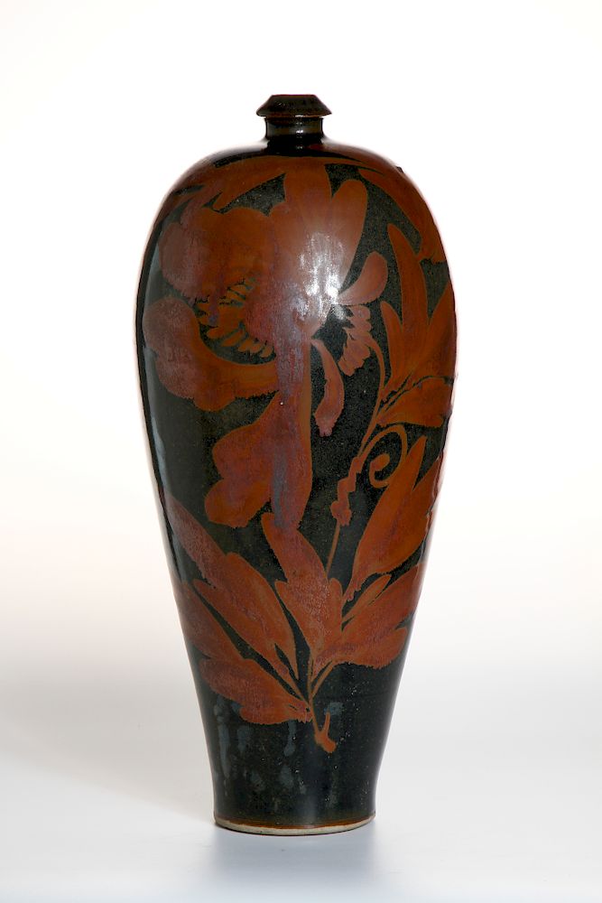 Appraisal: Cizhou Russet Painted Black-Glazed Meiping Vase The slender body gently