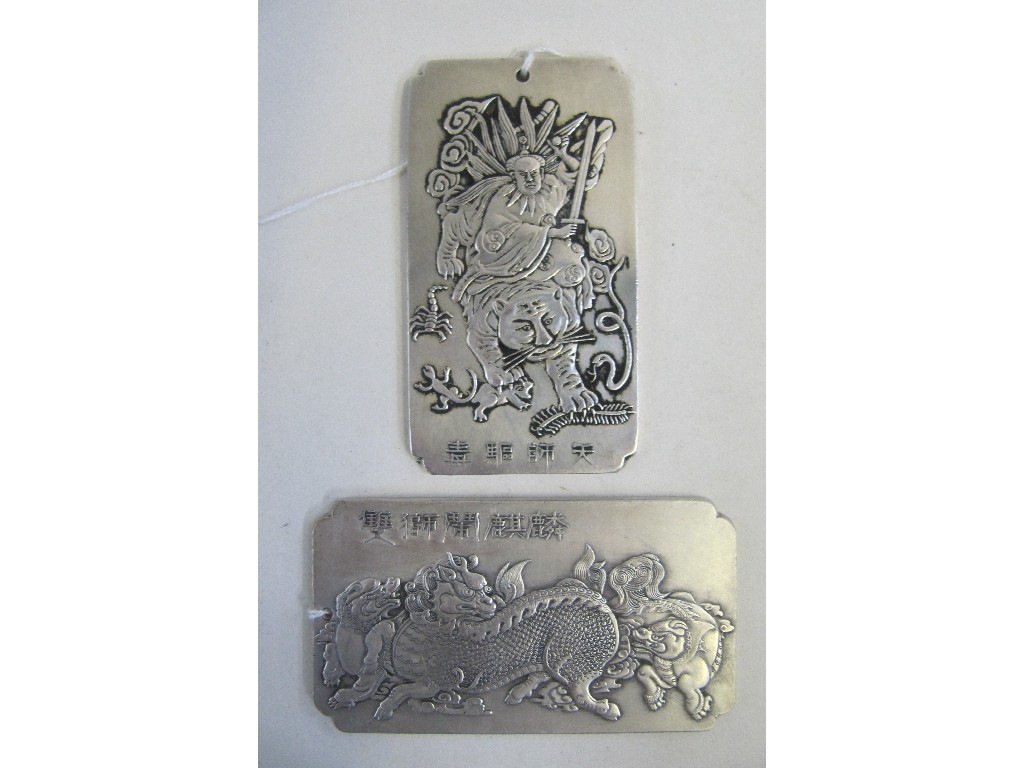 Appraisal: Lot comprising two oriental white metal plaques