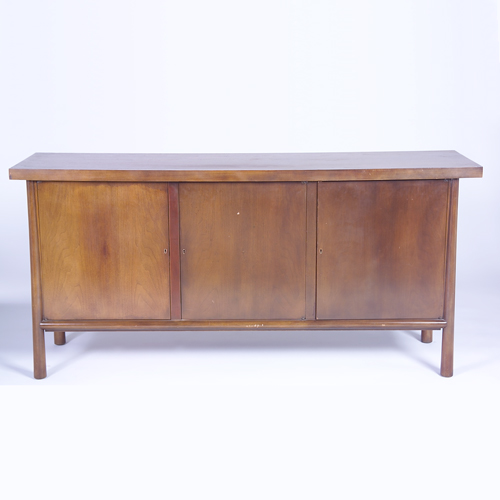 Appraisal: T H ROBSJOHN-GIBBINGS WIDDICOMB Walnut sideboard with overhanging rectangular top