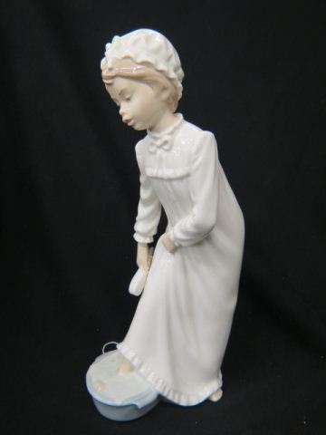 Appraisal: Nao Lladro Figurine of Young Girl in night clothing washing