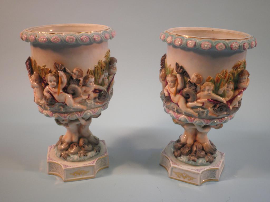 Appraisal: A pair of late thC German porcelain urns each moulded