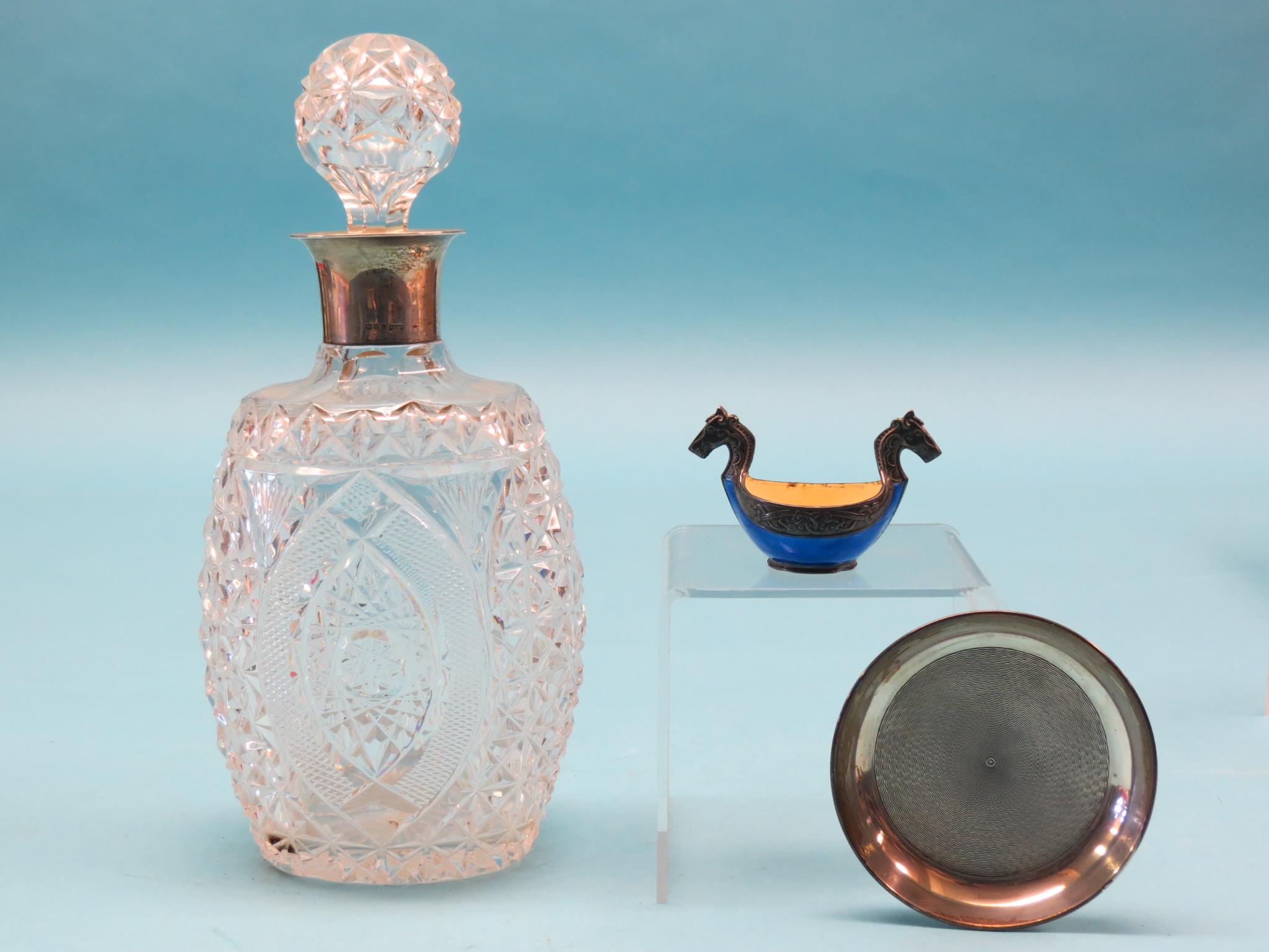 Appraisal: A cut glass decanter with stopper and silver mount Mappin