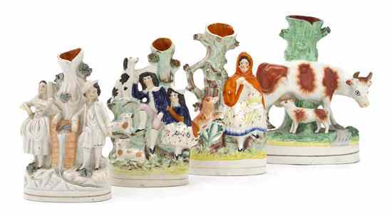 Appraisal: A Collection of Four Staffordshire Spill Vases depicting a cow