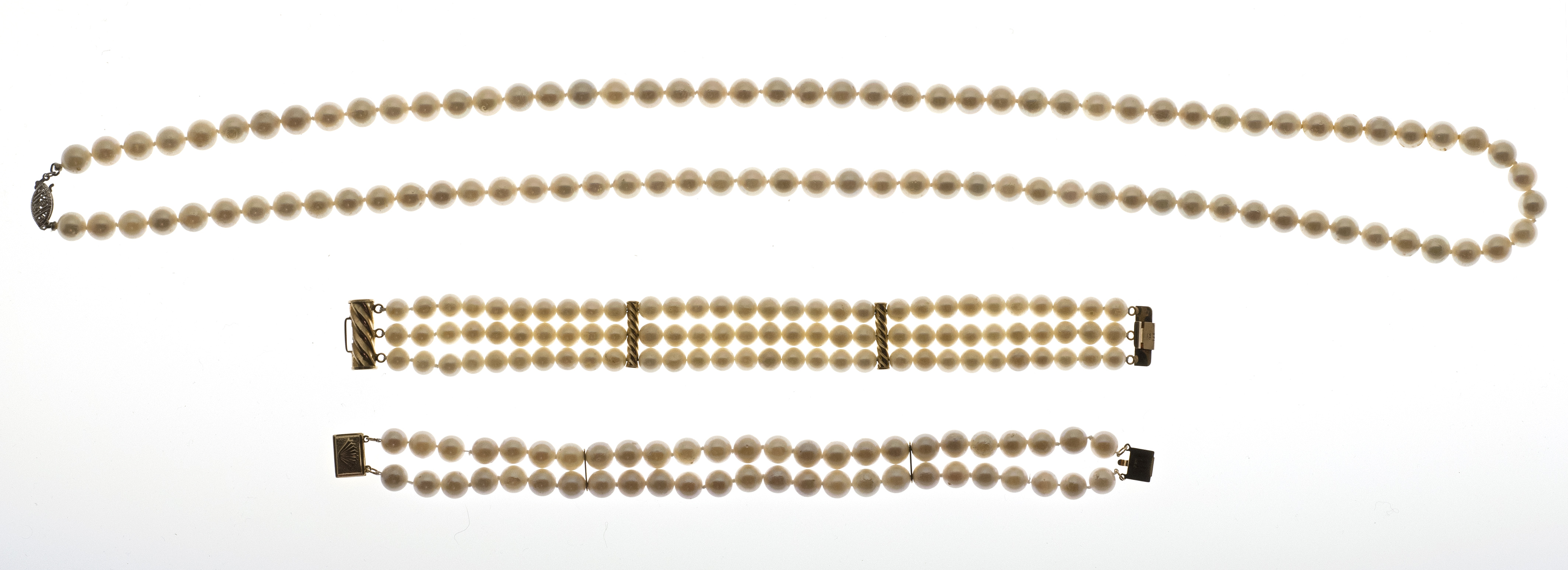 Appraisal: CULTURED PEARL NECKLACE AND TWO PEARL BRACELETS The necklace with