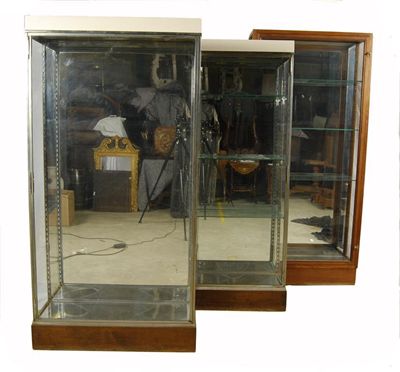 Appraisal: A pair of glazed display cabinets each with a mirrored