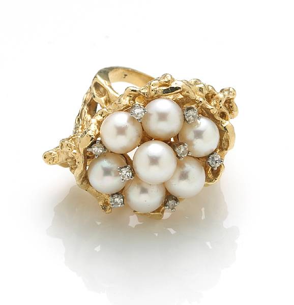 Appraisal: A cultured pearl diamond and k bicolor gold cluster ring