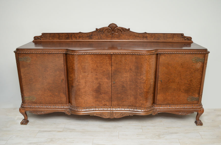 Appraisal: RICHLY GRAINED BURLED WALNUT SIDEBOARD Cabinet with gadroon edging acanthus