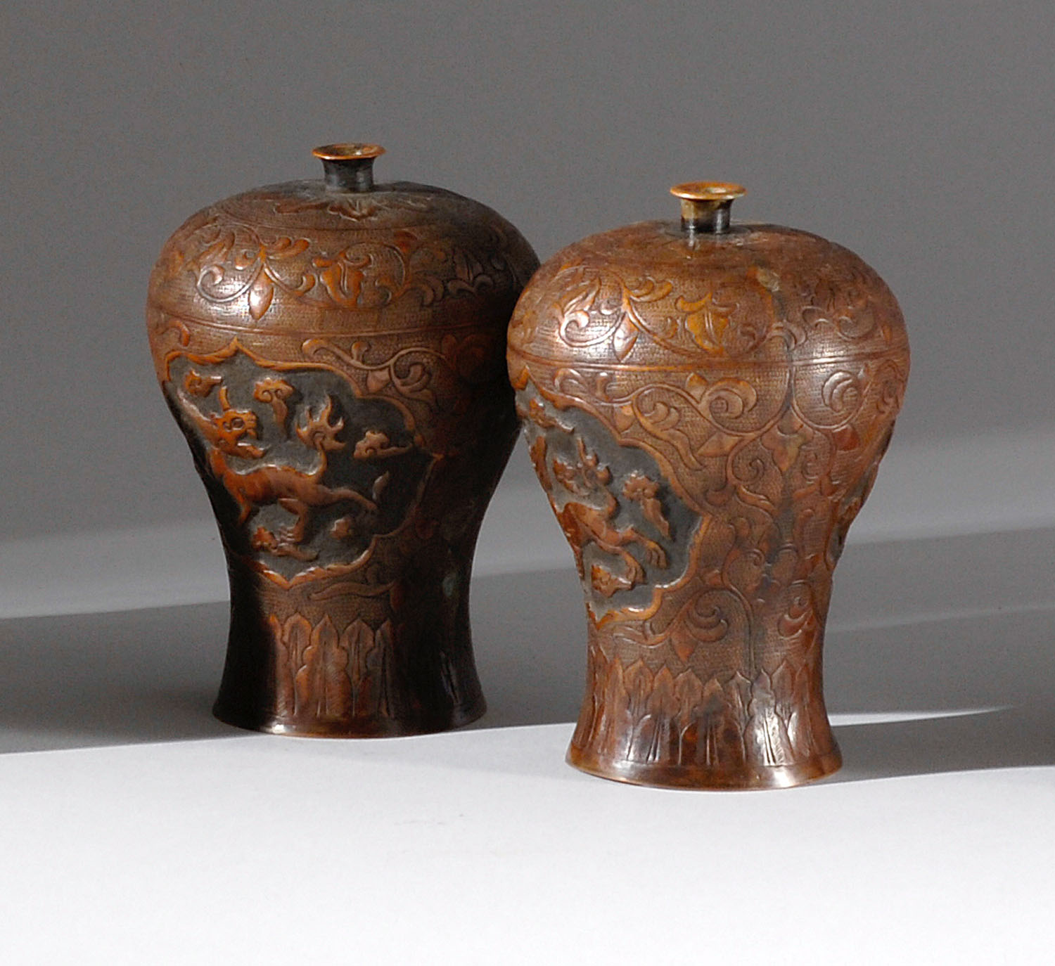 Appraisal: PAIR OF COPPER-BRONZE VASES Circa In meiping form with relief