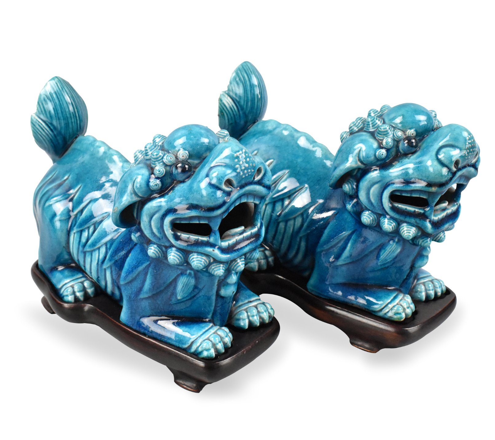 Appraisal: A pair of Chinese peacock glazed foo lion figures on