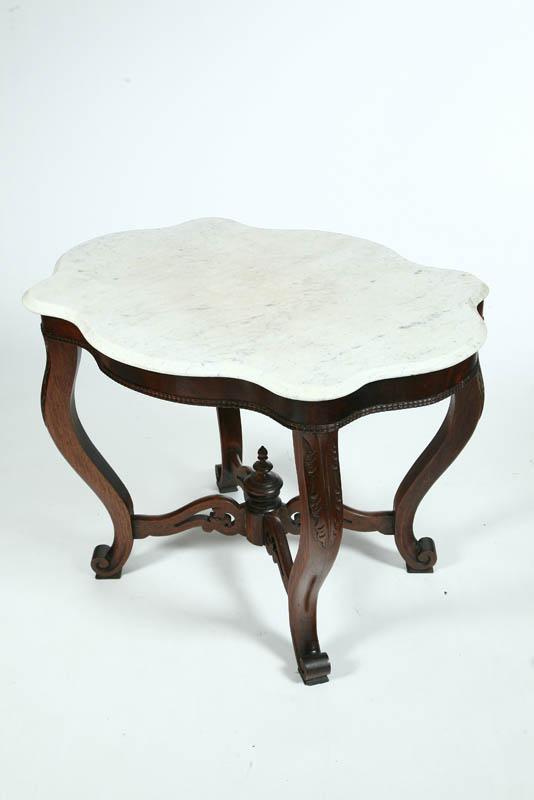 Appraisal: MARBLE TOP STAND White marble turtle top on a carved