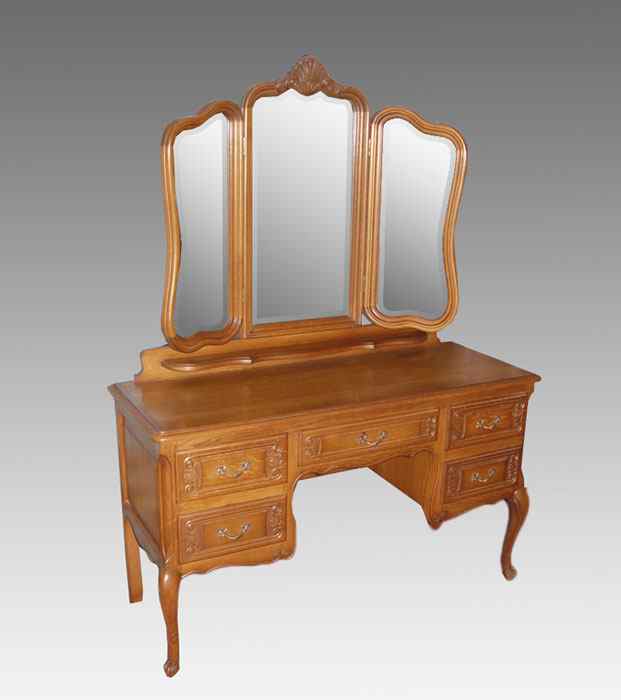 Appraisal: COUNTRY FRENCH OAK DRESSING TABLE WITH TRIPLE MIRROR Beveled gull