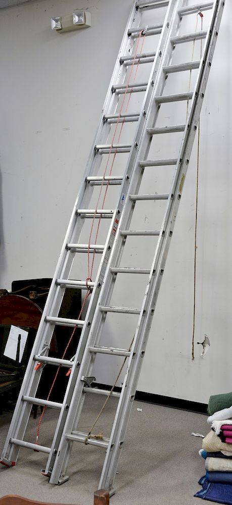 Appraisal: Two aluminum extension ladders Two aluminum extension ladders Condition All