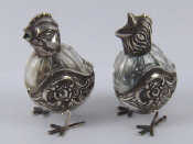 Appraisal: A pair of continental grade silver mounted glass pepper and