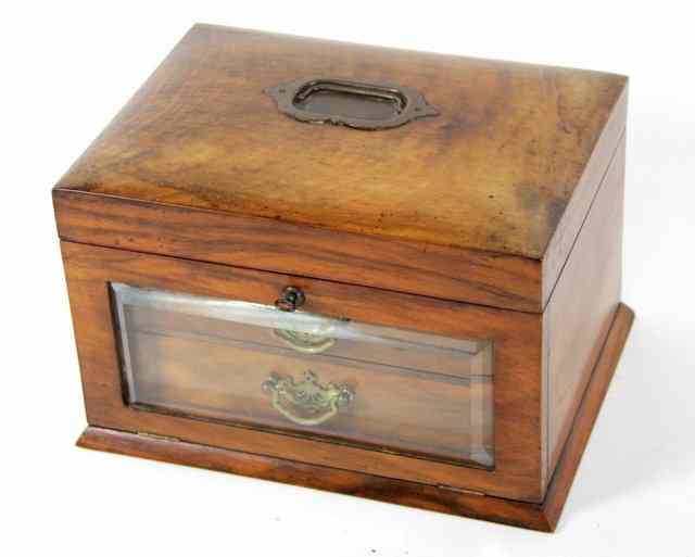 Appraisal: A Victorian walnut workbox the slightly domed cover with carry