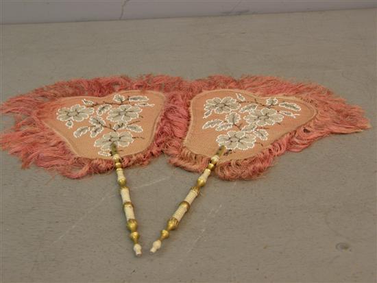 Appraisal: Pair of th century pink needlework fans with gilt and