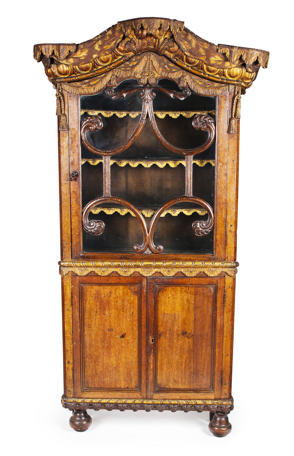 Appraisal: DUTCH CARVED OAK AND PARCEL GILT BOOKCASE CABINET MID TH