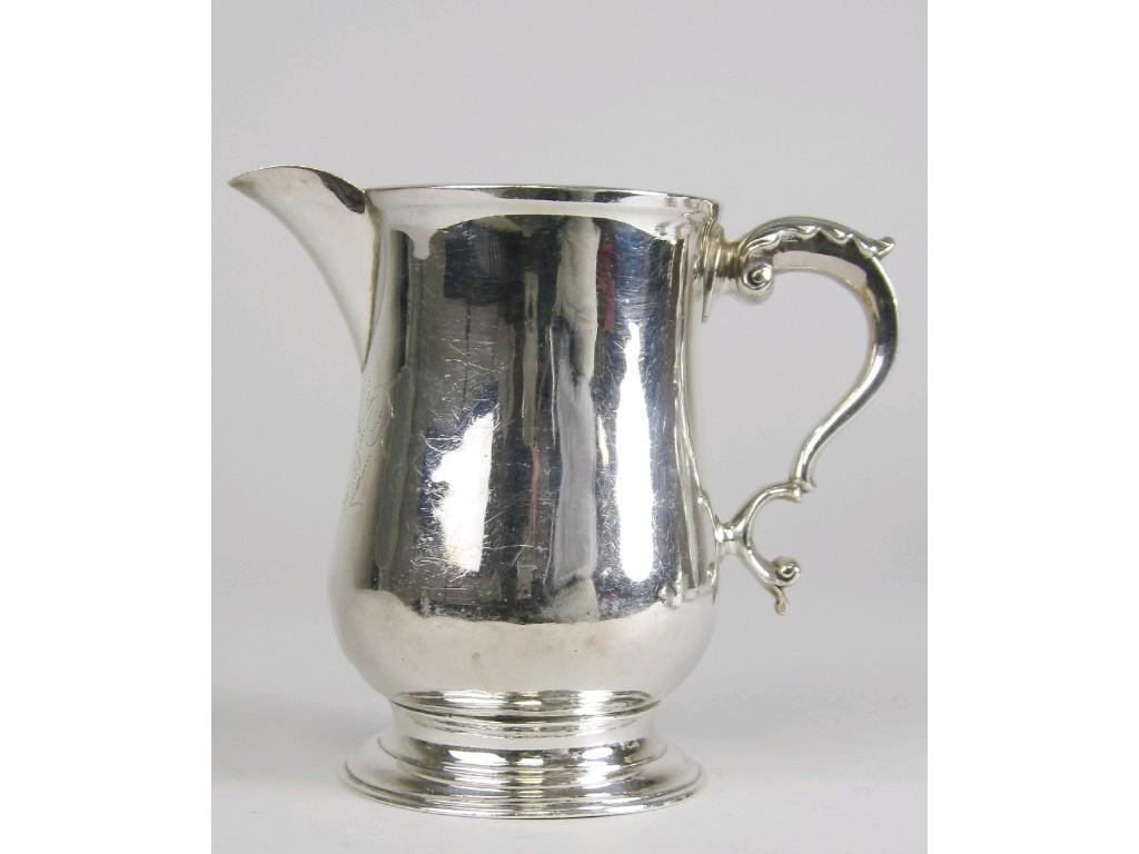 Appraisal: A George III baluster Jug engraved initials leafage scroll handle