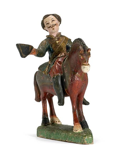 Appraisal: A Spanish Colonial carved wood and polychrome decorated equestrian figure