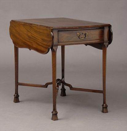 Appraisal: GEORGE III CARVED MAHOGANY PEMBROKE TABLE The bowed top with