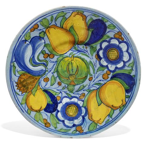 Appraisal: A Venetian maiolica dish circa Painted with fruit and vegetables