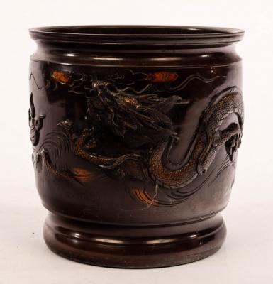 Appraisal: A Japanese bronze urn decorated a dragon pursuing a flaming