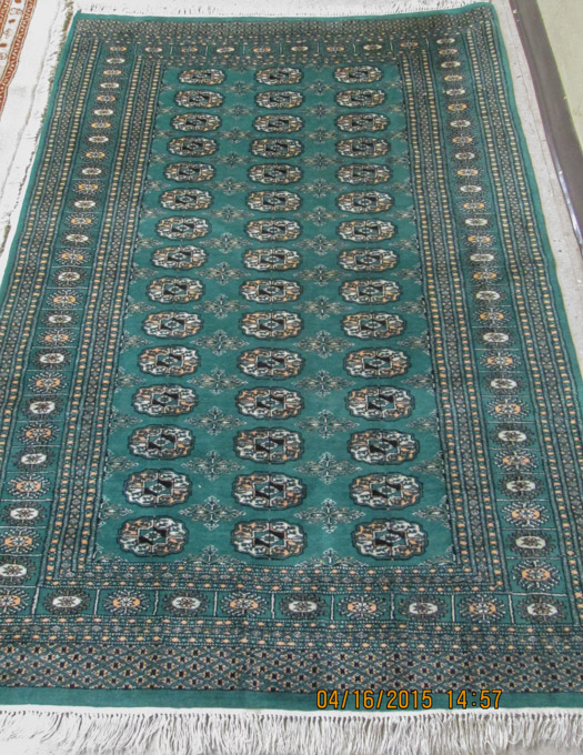 Appraisal: HAND KNOTTED ORIENTAL AREA RUG green field Bokhara ' x