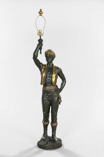 Appraisal: Ebonized and Parcel-Gilt Wood Composition Blackamoor Figure his flambeau now