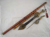 Appraisal: A Chinese bamboo flute with incised writing a bamboo whistle