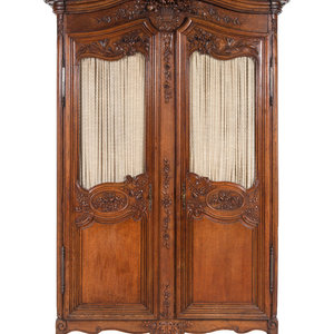 Appraisal: A Louis XV Provincial Style Carved Walnut Armoire th Century