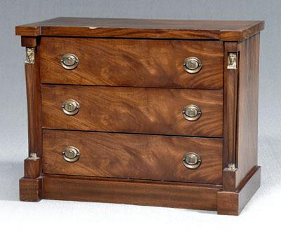 Appraisal: French Empire mahogany commode dovetailed construction highly figured veneers three