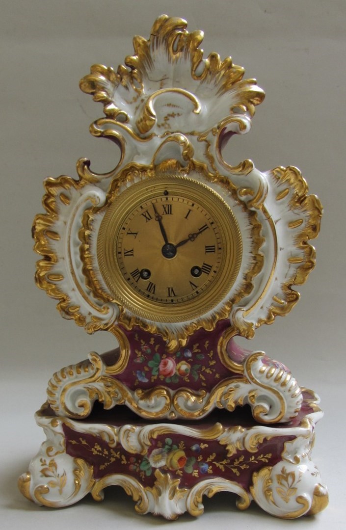 Appraisal: A porcelain mantel clock early th century the rococo shaped