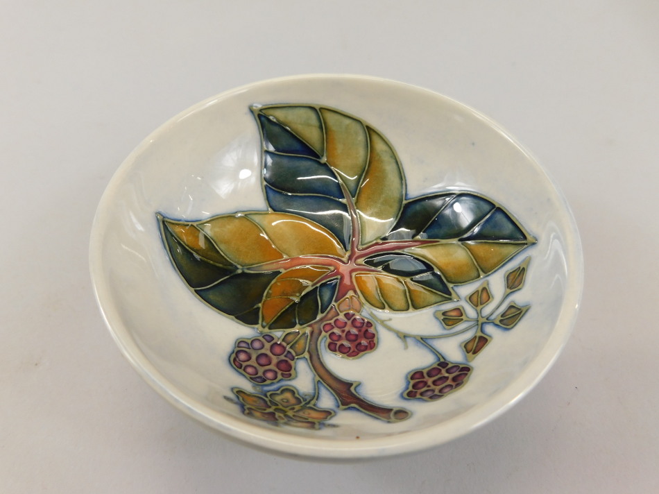 Appraisal: A Moorcroft small bowl decorated with Autumn leaves and berries