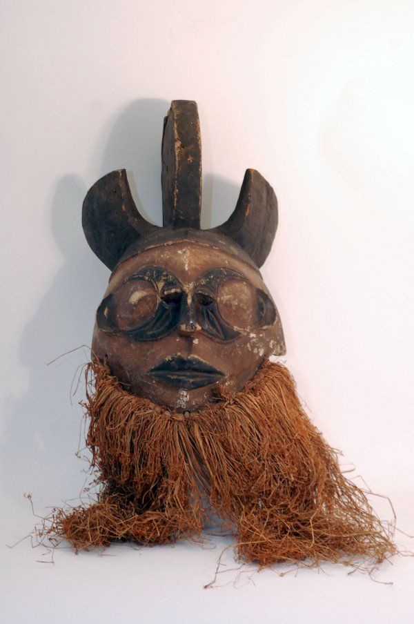 Appraisal: Ibo mask possibly a mmwo spirit maiden mask red patinated