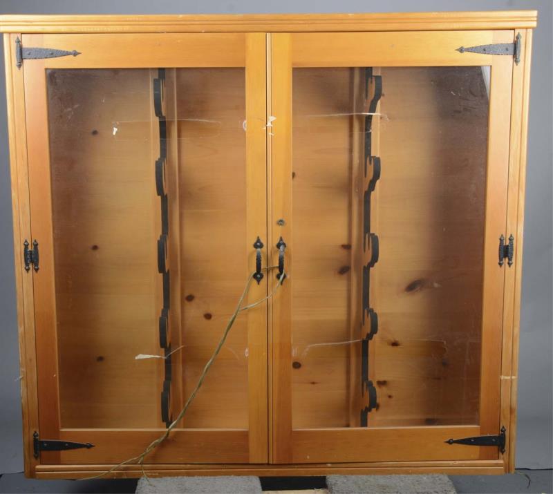 Appraisal: Pine Rifle Showcase Pine showcase with glass double doors and