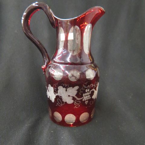 Appraisal: Bohemian Ruby Cut-to-Clear Pitcher grape vine decor th century chips