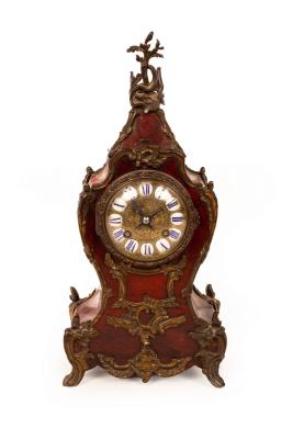 Appraisal: A gilt metal mounted tortoiseshell cased eight-day mantel clock with