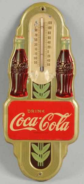 Appraisal: Coca-Cola Embossed Tin Thermometer Wear paint chips and surface rust