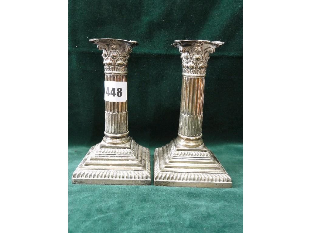 Appraisal: A pair of Georgian style Corinthian column candlesticks with relief